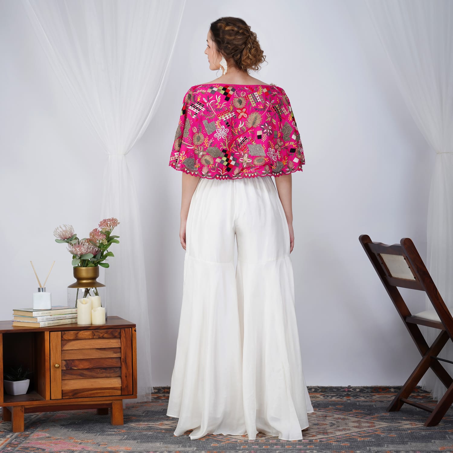 Back view of pink pearl-embroidered Zardosi cape with white skirt